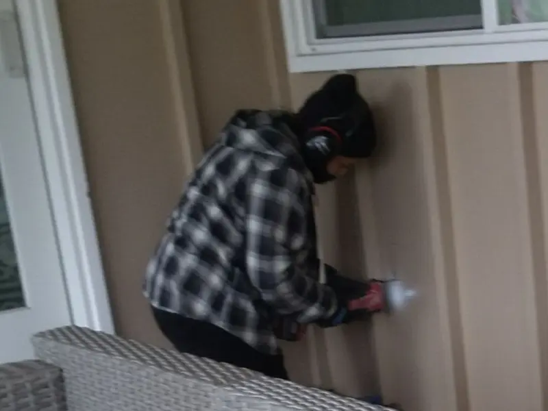 Professional electrician installing an exterior outlet in Racine