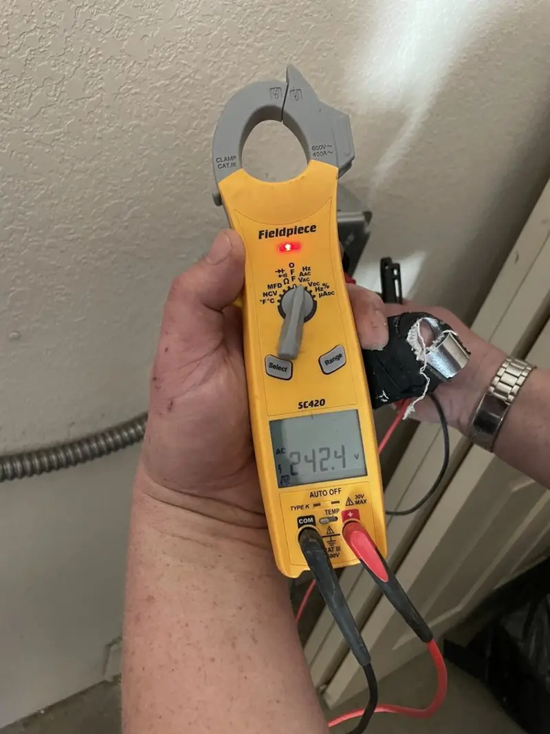 Voltage testing with clamp meter during Generator Installation in Racine